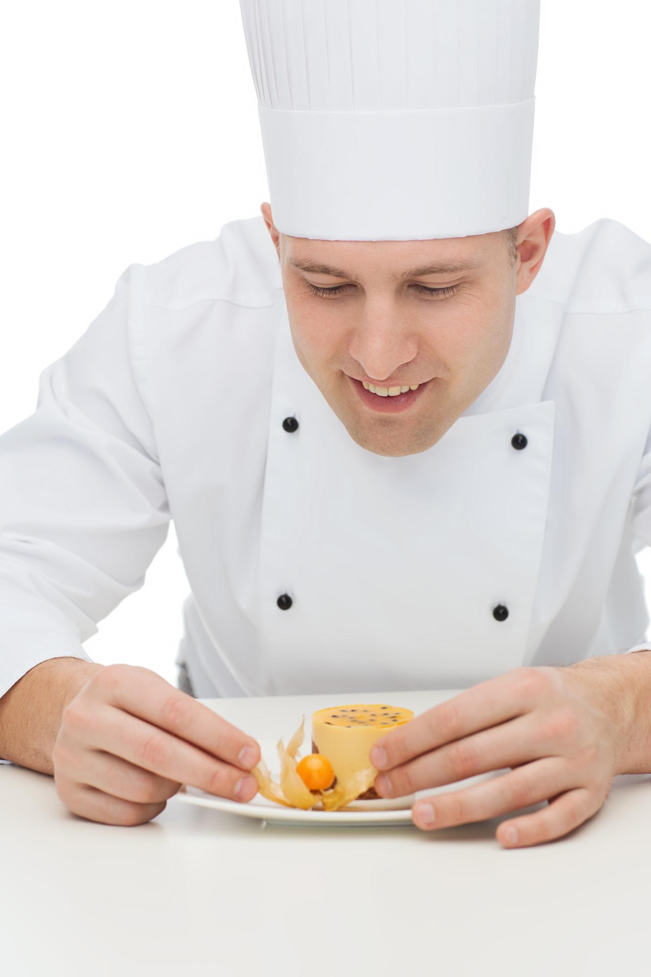 Instructor demonstrating technique over a plated dish